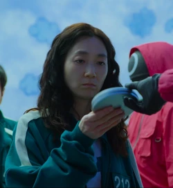where did player 212 hide her cigarettes Han Mi-nyeo | Squid Game Wiki
