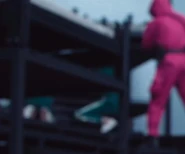 Player 028 when the guards tell her and Player 400 to lie on the ground