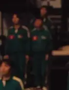 Player 050 watching as Seong Gi-hun has an outburst.