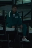 A male player 77 before red light green light