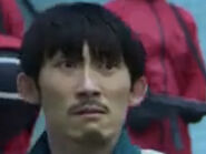 Player 271 looking at Jang Deok-su as Player 198 says they got seconds