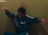 Yun-ho being shot multiple times by Pink Guards.