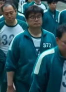 Male Player 372 in the food queue