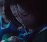 Jun-hee holding her baby.