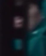 Player 080 listening to the list of the bathroom fight eliminations.