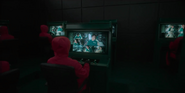 Player 031 (center left) being monitored by Squid Game staff
