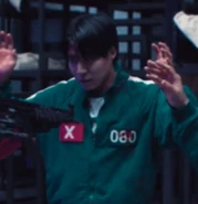 Player 080 being held at gunpoint after breaking up his fight.