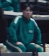 Player 080 listening to the manager explain the games.