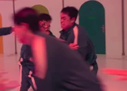 Player 080 leading Players 111 and 131 to a room during Mingle round 3.