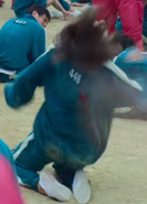 Player 446 getting shot by a soldier after breaking her piece of dalgona
