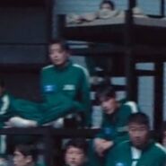 Player 260 looking at Gi-hun as he woke up.