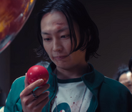 Nam-gyu receiving a red ball from the Gumball machine