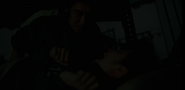 Deok-su preparing to kill Player 198 with a broken bottle