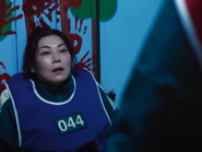 Seon-nyeo dying after getting stabbed in the stomach by Park Min-su during Hide and Seek.