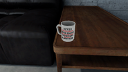 Never underestimate a coffee enjoyer who left their cup by a leather sofa that faces a blurry room.