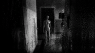 Exclusive to The Stanley Parable 4. A noir-like and gloomy image of Stanley's wife with rain droplets over the screen.