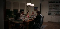 The Fisher and Conklin-Park Families eat dinner together.