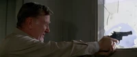 Garry aiming through the rec room window, The Thing (1982)