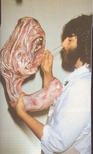 Effects artist Rob Bottin painting Split-Face's merged heads