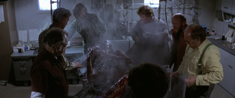 U.S. Outpost 31 team members examine their terrifying find