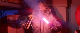 MacReady threatens the paranoid men with dynamite, The Thing (1982)