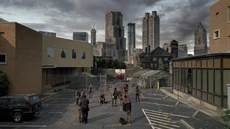 El grupo llorando la muerte de Beth en las afueras del hospital.