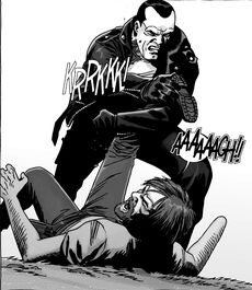 Negan quebrando la pierna de Rick en un último intento por ganar la guerra.