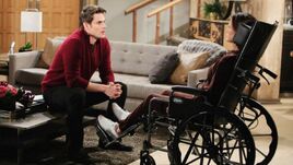 Adam talking to Cheslea in a wheelchair