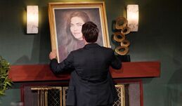 Adam takes Victoria's portrait down