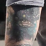 UFO arm tattoo (c. 2017)