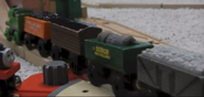 Percy pulls a long freight train while Mike watches.