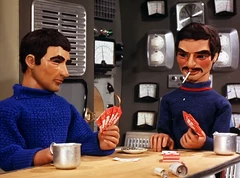 Ritter and another man play cards aboard the mini sub