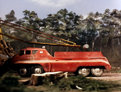 Pulp canisters being transferred while vehicles are still moving