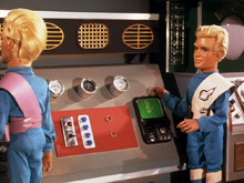 Thunderbird 5 listens to the Cass Carnaby Five's musical broadcast