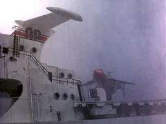 Thunderbird 1 lands on the helipad of the ship