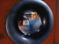 Scott, seen through a cockpit window (Pit of Peril)