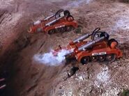 The two Recovery Vehicles firing their magnetic grapples.