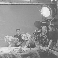 Michael Wilson (far right, behind John Foley) on the set of Tracy Island's swimming pool