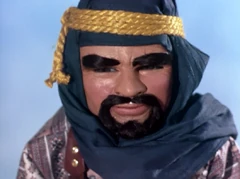 DI416.png (889 KB) As a bedouin; a goatee on his chin, wrapped in a blue head covering and a yellow rope around his forehead
