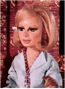 Lady Penelope wearing bead necklace