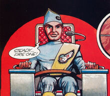 Virgil sitting in Thunderbird 1's pilot chair, preparing to launch missiles