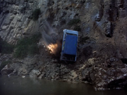 The van hits the river bank