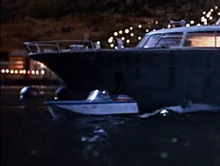 Parker goes ashore in the motorboat