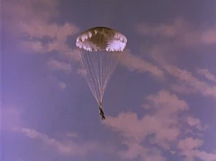 DA326.png (801 KB) The Dart's pilot floats safely to the ground