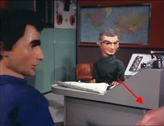 Puppeteer's hand in frame