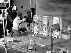 A crew member next to the Trans American T.V. Network buildings, which didn't make it into the final film