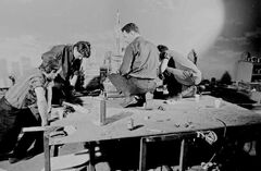 Derek Meddings (second right), Shaun Whittacker-Cook (far left), and others with the model of the Empire State Building