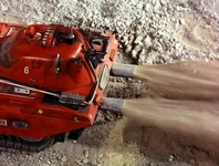 Crushed rock and dust blown out of the ducts