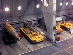 The Mole (far left) in the pod bay, next to the Fire Tender