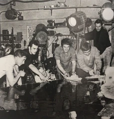 A similar photo to before of Garry Coxall (again, third on left) on the set of The Man From MI.5